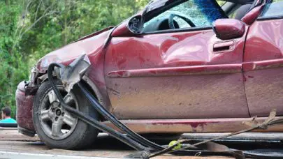 a red car that has been involved in a car accident