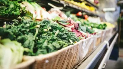 A Shot of produce lining an isle of a grocery store. Learn the steps to take if you're faced with contamination due to produce like this.