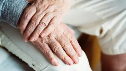 An elderly person's hands sitting on their lap, meant to represent the article "Nursing Home Malpractice: Do You Have a Case?" by MMRBH Law Office.