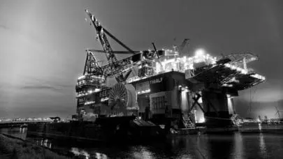 A black and white shot of an offshore rig where hydrogen sulfide dangers may lurk.