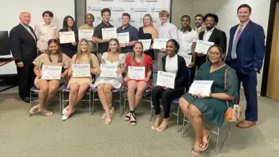 The 16 MMRBH Law Office 2023 scholarship recipients pose with their awards.