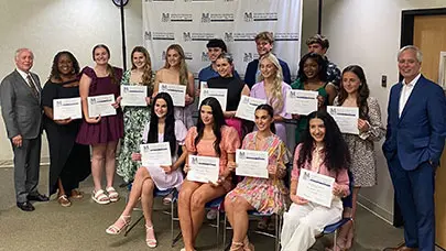 Pictured are the 15 MMRBH Scholarship Program winners for 2024, holding their certificates and smiling alongside Craig Morrow and Richard Haik Sr.